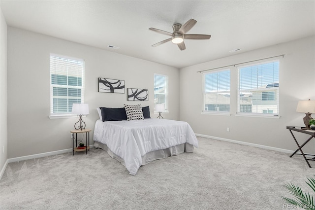 12941 Delaware St, Westminster, CO 80234 - carpeted bedroom featuring baseboards, multiple windows, and a ceiling fan
