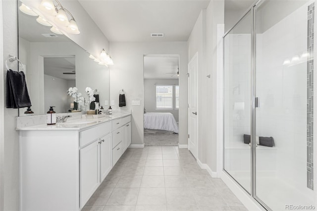 12941 Delaware St, Westminster, CO 80234 - full bathroom with ceiling fan, a shower stall, ensuite bathroom, double vanity, and tile patterned floors