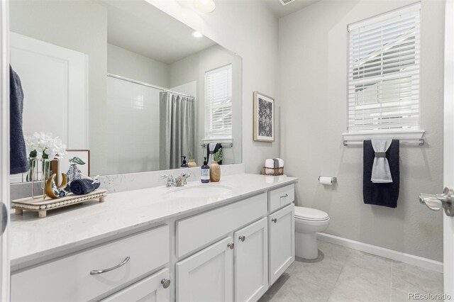 12941 Delaware St, Westminster, CO 80234 - full bathroom with plenty of natural light, baseboards, vanity, and toilet