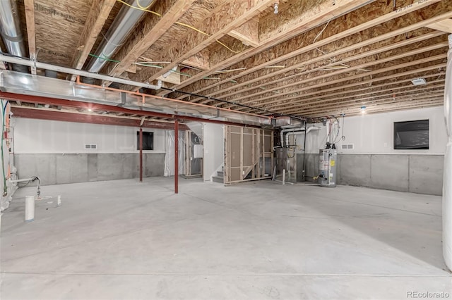 12941 Delaware St, Westminster, CO 80234 - unfinished basement featuring stairs and gas water heater
