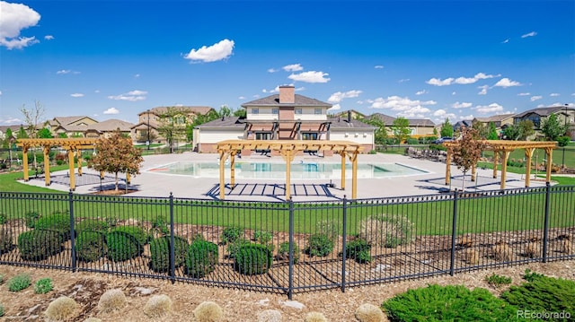 12941 Delaware St, Westminster, CO 80234 - view of playground with a pergola, fence, a residential view, and a community pool