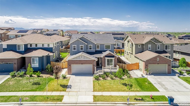 12941 Delaware St, Westminster, CO 80234 - traditional-style house featuring a residential view, concrete driveway, brick siding, and board and batten siding