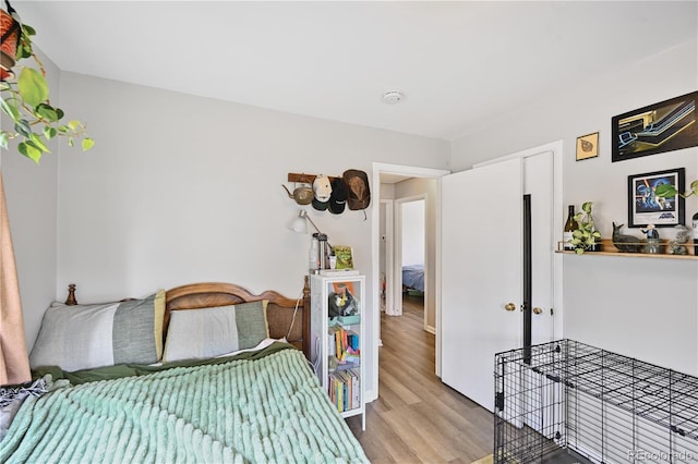 bedroom featuring wood finished floors