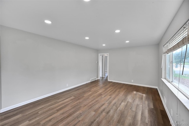 1801 S Eudora St, Denver, CO 80222 - empty room with dark wood-type flooring, recessed lighting, and baseboards