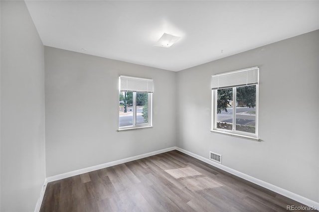 1801 S Eudora St, Denver, CO 80222 - unfurnished room featuring dark wood-style floors and baseboards