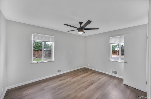 1801 S Eudora St, Denver, CO 80222 - spare room featuring plenty of natural light, wood finished floors, a ceiling fan, and baseboards