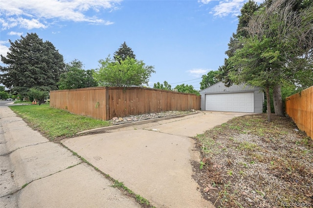 1801 S Eudora St, Denver, CO 80222 - view of side of property with an outdoor structure and a detached garage