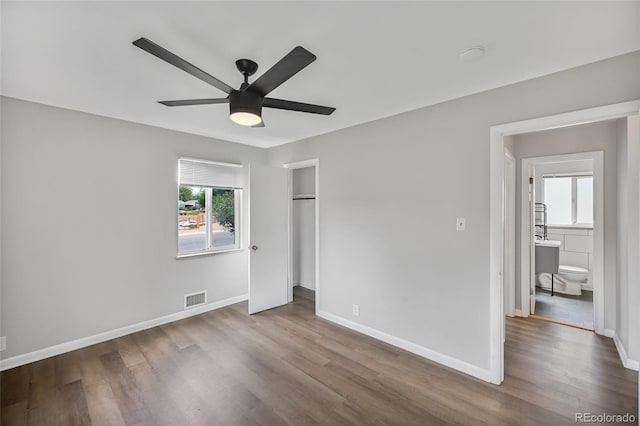 1801 S Eudora St, Denver, CO 80222 - unfurnished bedroom featuring wood finished floors, baseboards, and a closet