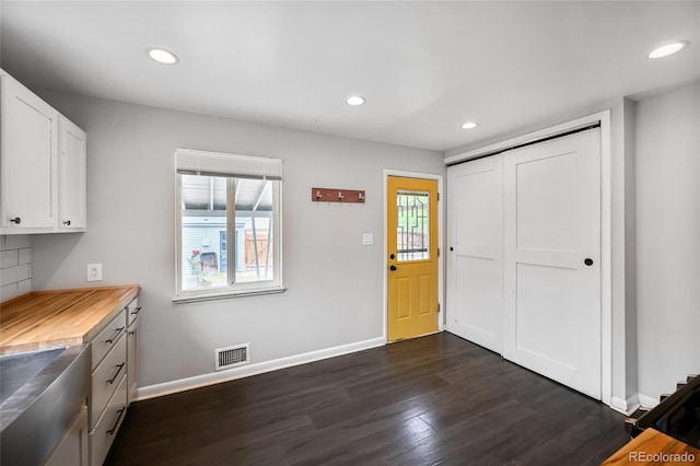 1801 S Eudora St, Denver, CO 80222 - kitchen featuring recessed lighting, dark wood-style floors, white cabinets, baseboards, and decorative backsplash