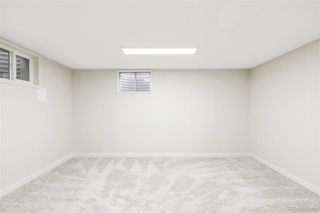 basement with baseboards and carpet