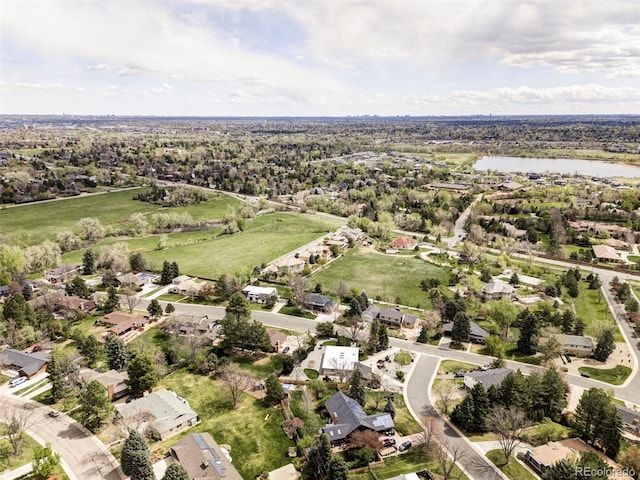 birds eye view of property featuring a water view and a residential view