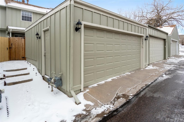 view of snow covered garage