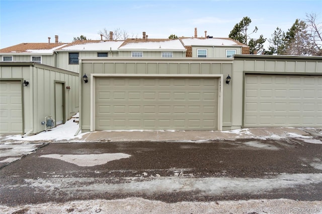 view of snow covered garage