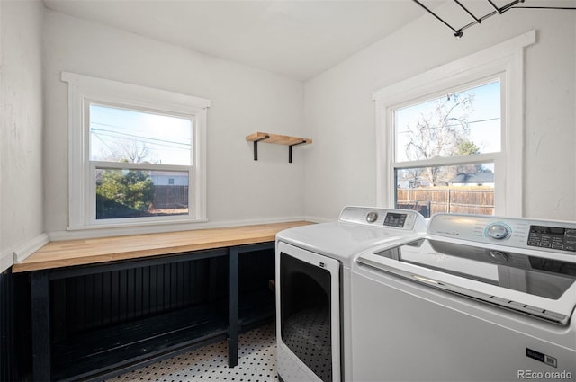 washroom with washing machine and clothes dryer