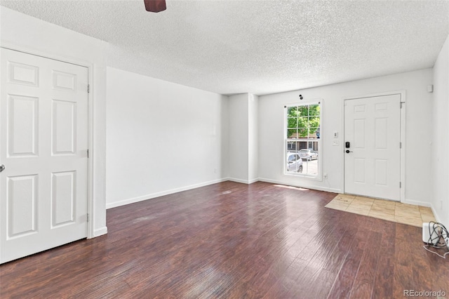 14465 E Hawaii Cir Unit A, Aurora, CO 80012 - entrance foyer featuring wood finished floors, a textured ceiling, and baseboards