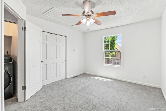 14465 E Hawaii Cir Unit A, Aurora, CO 80012 - unfurnished bedroom featuring carpet flooring, a textured ceiling, a closet, baseboards, and a ceiling fan