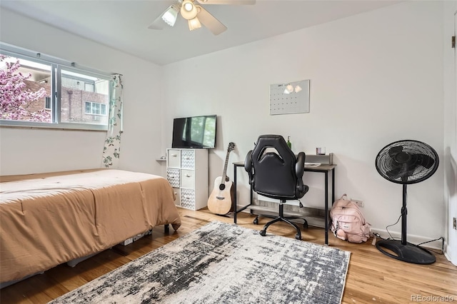 5184 E Asbury Ave, Denver, CO 80222 - bedroom with wood finished floors and a ceiling fan