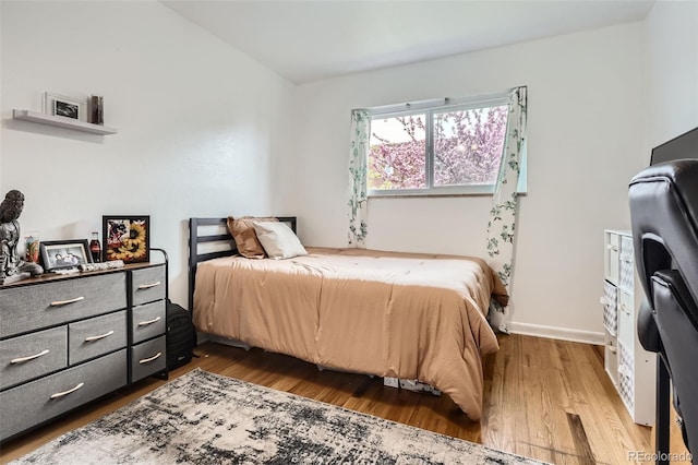 5184 E Asbury Ave, Denver, CO 80222 - bedroom featuring wood finished floors and baseboards