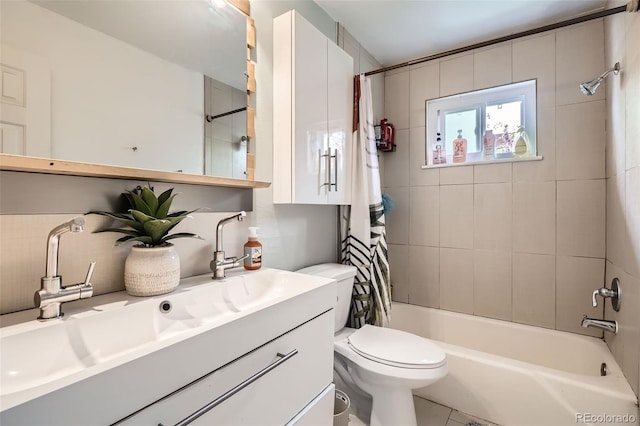 5184 E Asbury Ave, Denver, CO 80222 - bathroom with shower / bath combo with shower curtain, vanity, and toilet