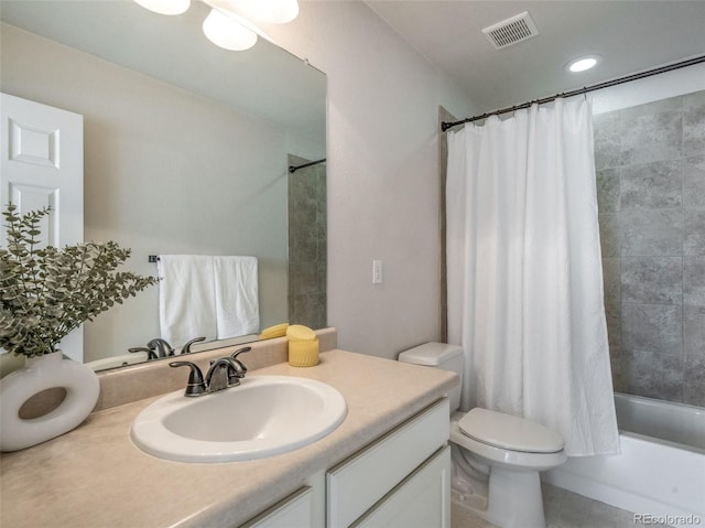 full bathroom featuring vanity, shower / bath combination with curtain, and toilet