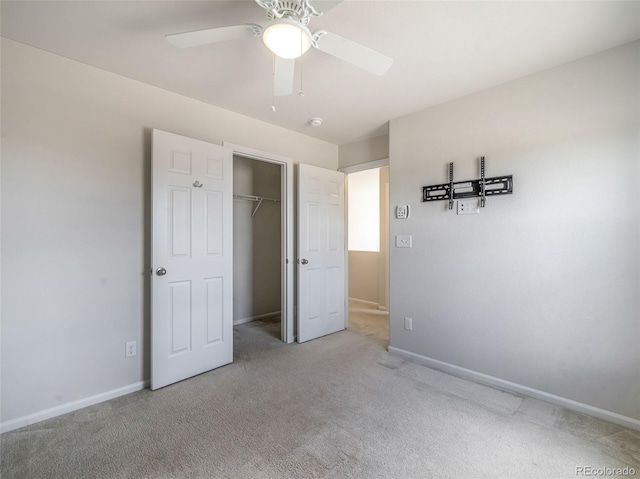 unfurnished bedroom featuring ceiling fan, carpet floors, and a closet