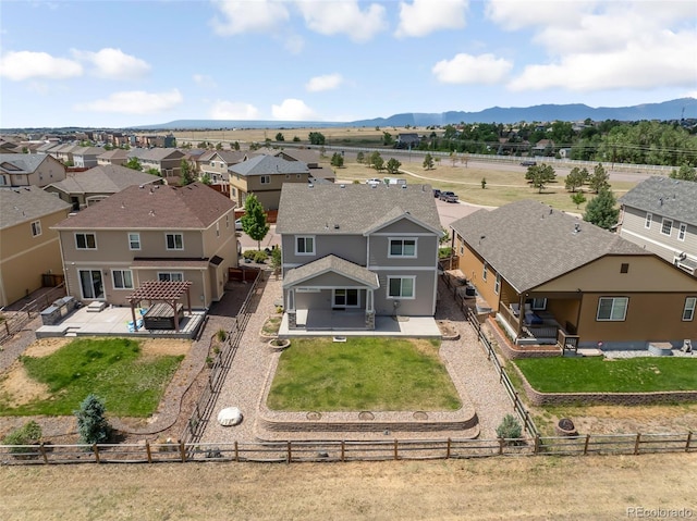 birds eye view of property featuring a mountain view