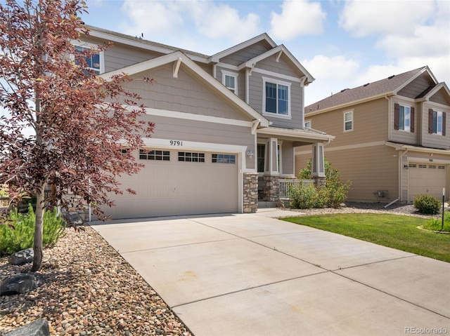 craftsman house with a porch and a garage