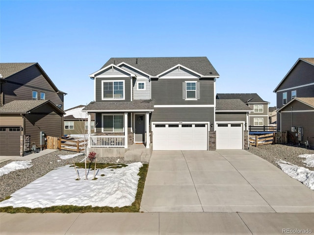 view of front of home featuring a porch and a garage