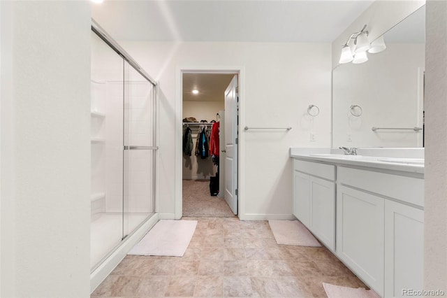 bathroom with vanity and an enclosed shower