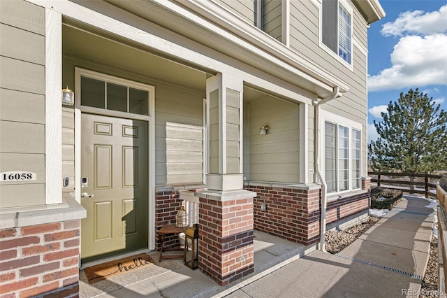 entrance to property featuring a porch