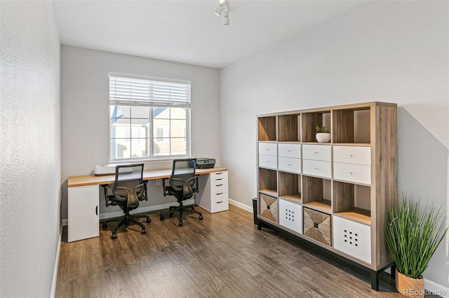 office with dark hardwood / wood-style flooring