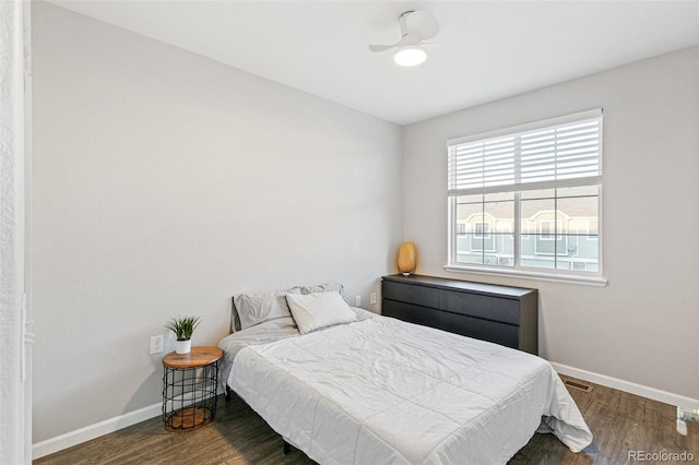 bedroom featuring ceiling fan and dark hardwood / wood-style flooring