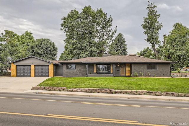 ranch-style home featuring a front yard and a garage