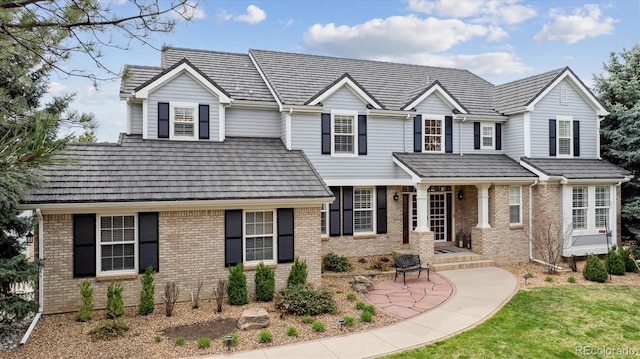 traditional-style house featuring brick siding
