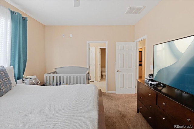 carpeted bedroom with ceiling fan