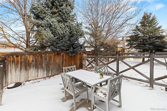 view of snow covered patio