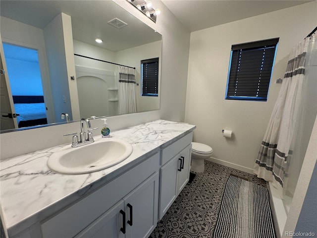 bathroom with vanity, tile patterned flooring, a shower with curtain, and toilet