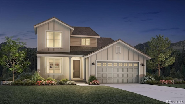 view of front facade with a garage and a yard