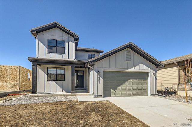 modern farmhouse style home featuring an attached garage, driveway, and board and batten siding