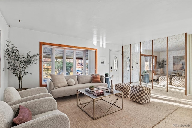 carpeted living room with a healthy amount of sunlight