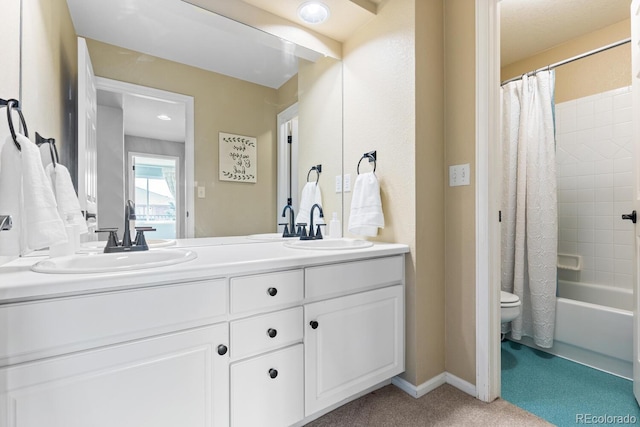 full bathroom featuring vanity, shower / tub combo, and toilet