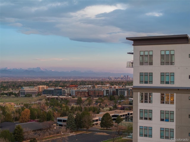 property's view of city with a mountain view