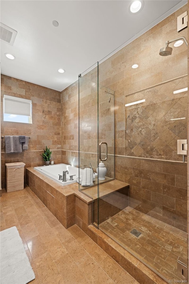 bathroom with visible vents, tile patterned flooring, recessed lighting, a stall shower, and a garden tub
