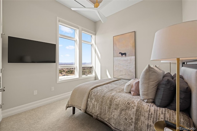carpeted bedroom with baseboards