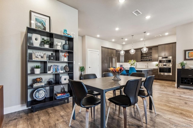 dining area with light wood-type flooring