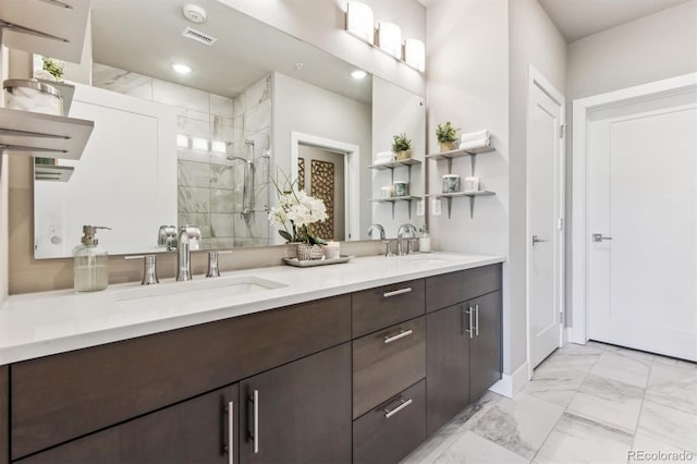 bathroom with vanity and a shower with shower door