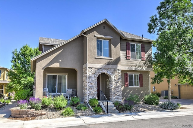 10550 Ashfield St, Highlands Ranch, CO 80126 - view of front of property with stucco siding, stone siding, and covered porch