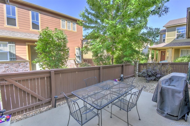 10550 Ashfield St, Highlands Ranch, CO 80126 - view of patio / terrace with outdoor dining area and a grill