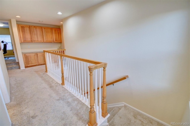 10550 Ashfield St, Highlands Ranch, CO 80126 - corridor with light colored carpet, an upstairs landing, and recessed lighting