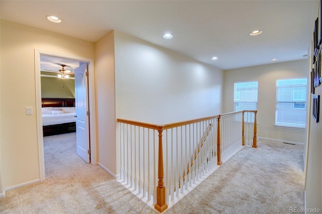 10550 Ashfield St, Highlands Ranch, CO 80126 - corridor featuring carpet, an upstairs landing, and recessed lighting